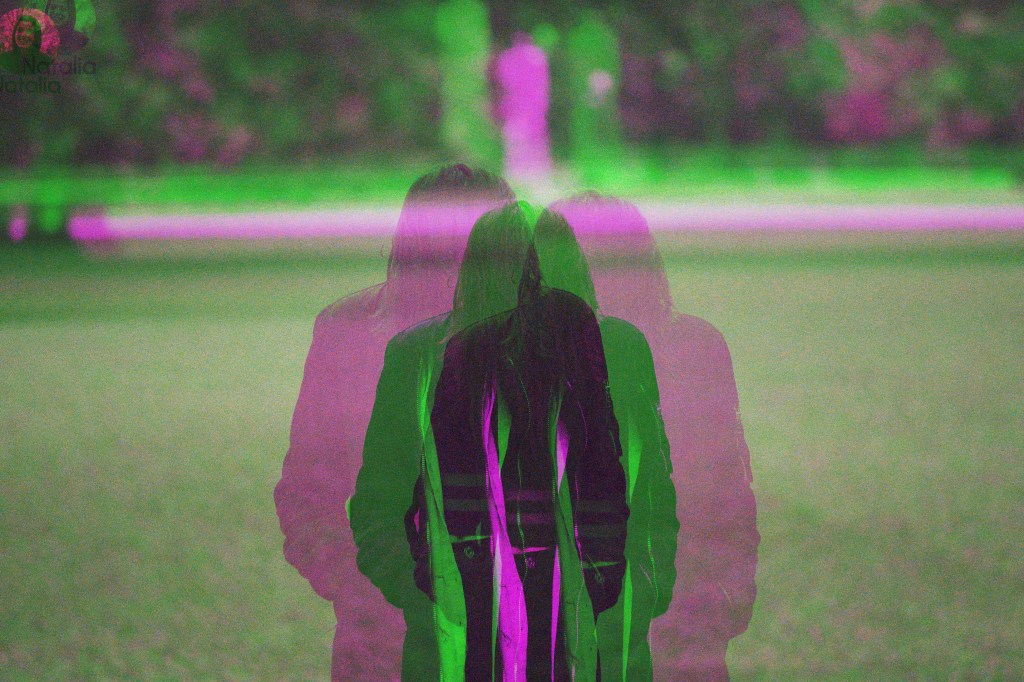 Image: shot of a young woman in park wearing autumn clothing from behind, the photo double exposed in green and purple for an optical illusion effect
